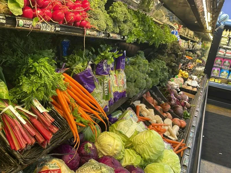 Fresh vegetables and herbs on a supermarket display